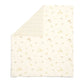 Cream 25 tog quilt with small jungle animal print, folded corner view