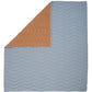 Wave quilt folded: light blue quilt top with wavy quilting and brown side panel