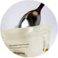 Reusable food sachet pouch close-up, light beige with icons and spoon filling