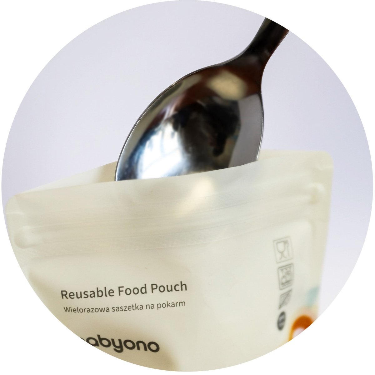 Reusable food sachet pouch close-up, light beige with icons and spoon filling