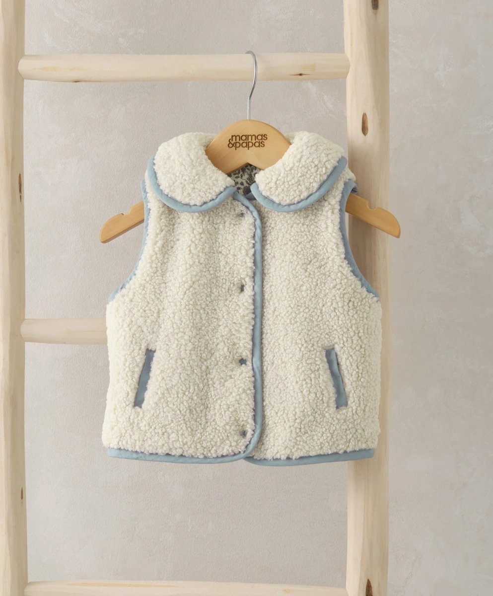 Cream borg fleece gilet with blue trim, zip front, side pockets