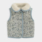 Reversible gilet with blue-trimmed patterned fabric, zip front, side pockets