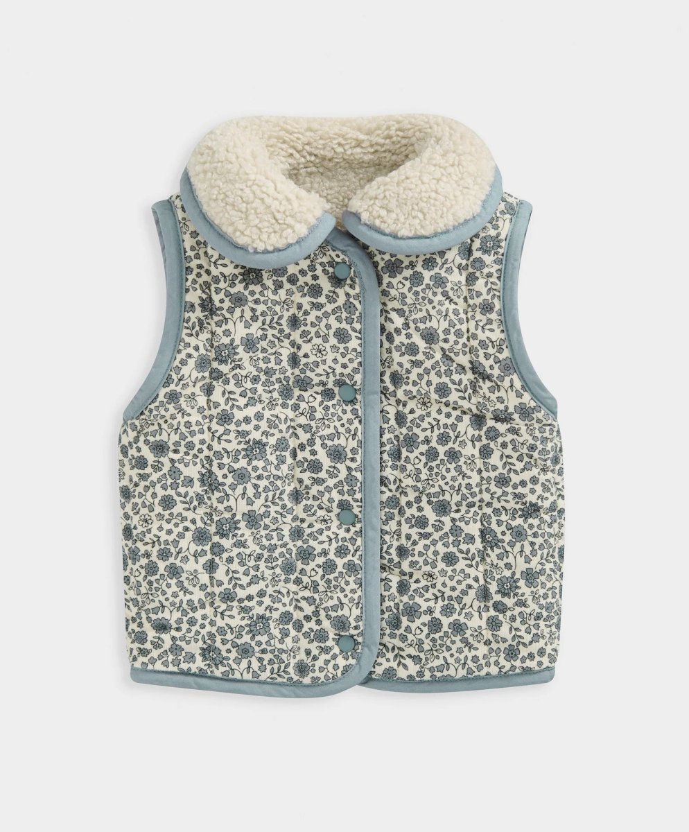 Reversible gilet with blue-trimmed patterned fabric, zip front, side pockets