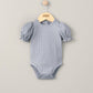 Heather blue ribbed bodysuit with short puff sleeves and snap-button crotch