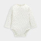 Off-white patterned long-sleeve bodysuit with snap leg opening