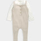 Ribbed oatmeal dungarees with adjustable straps and snap front over patterned bodysuit