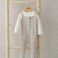 Ribbed dungarees in oatmeal with front button placket over patterned long-sleeve bodysuit