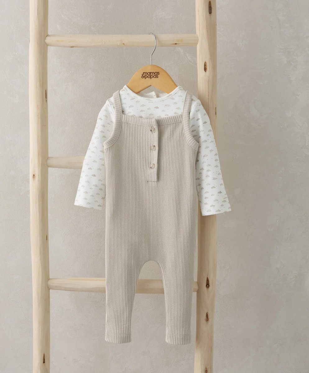 Ribbed dungarees in oatmeal with front button placket over patterned long-sleeve bodysuit