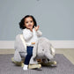 Plush gray elephant rocking animal with cushioned seat on wooden rockers