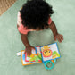 Soft cloth baby book with safari animals and lion face on fabric pages, teal handle