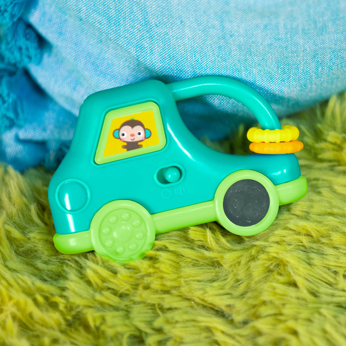 Teal safari driver toy car with character window and yellow light detail