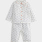 White floral pyjama set with long sleeves, button front, and scalloped leg trim