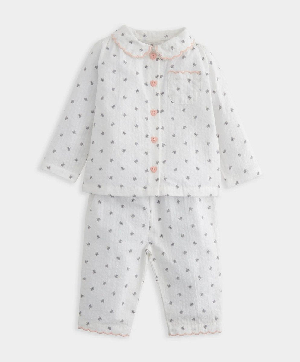 White floral pyjama set with long sleeves, button front, and scalloped leg trim