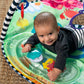 Water mat play gym water pad with sea creatures and smiling infant reaching