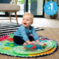 Water mat play gym with sea-themed graphics and infant sitting on mat