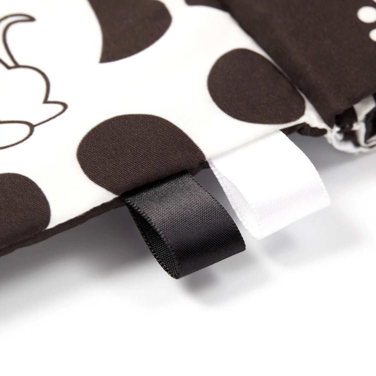 Cloth sensory book cover detail with black fabric strap and stitched ribbon