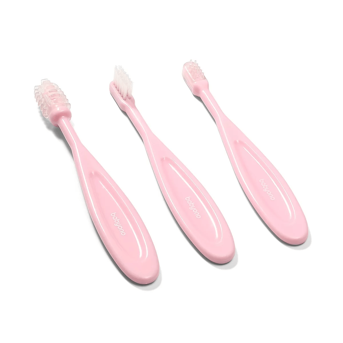 Pink toothbrush set with three handles and soft bristle heads