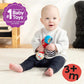 Baby holding shake-and-groove maraca rattles, blue and red toy in hands