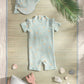 Light blue short-sleeve rashguard swimsuit with allover lemon print