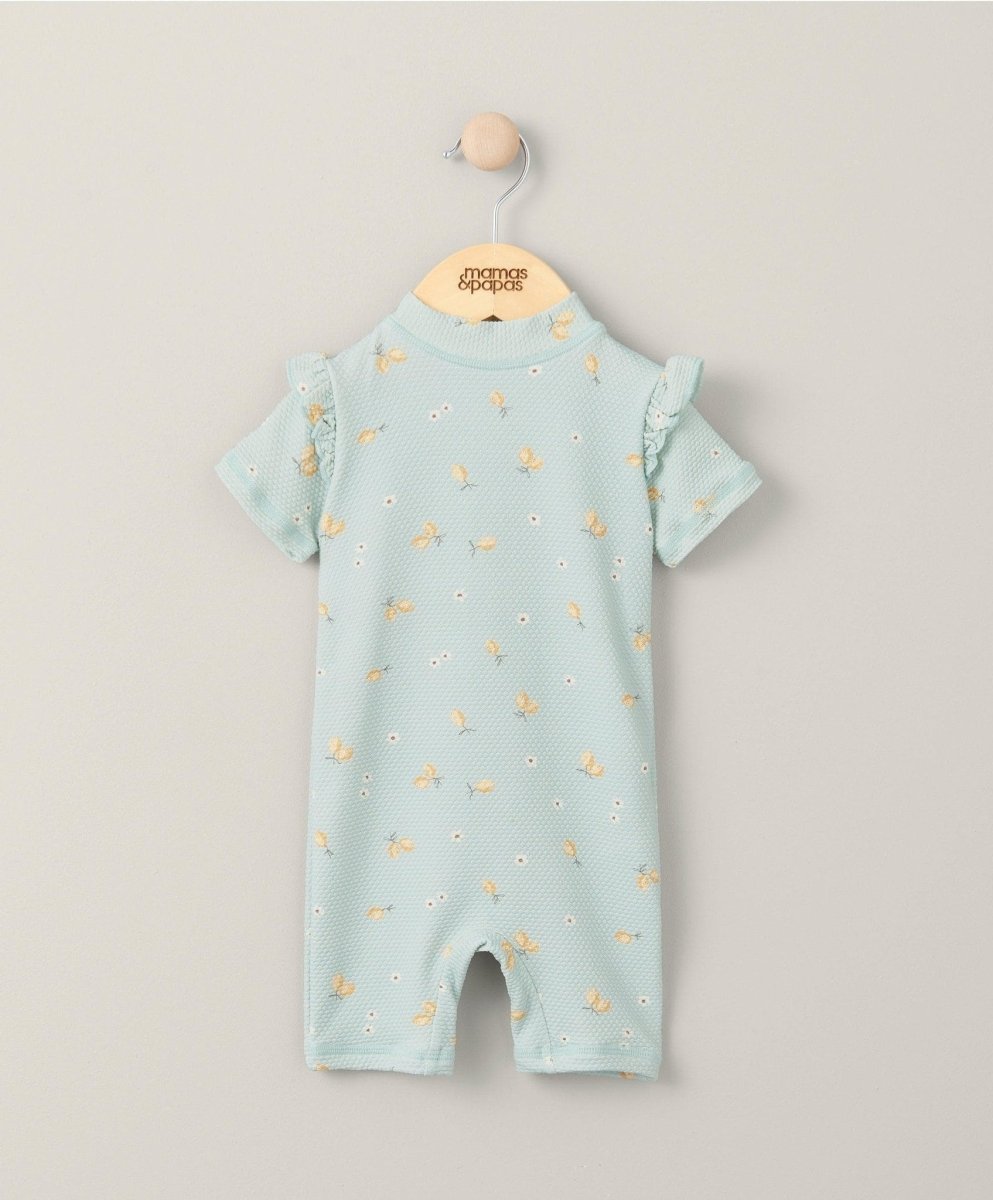 Light blue short-sleeve rashguard swimsuit with small lemon print and high neck