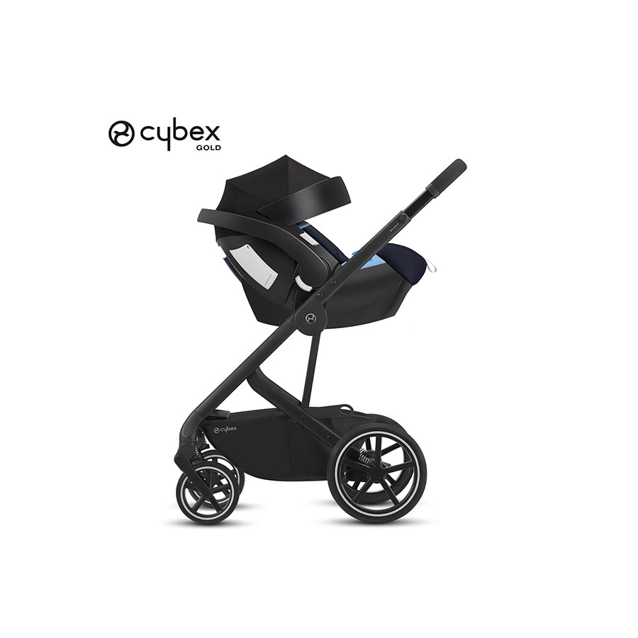 Black stroller with convertible car seat and canopy, blue accents