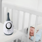 Baby monitor adapter on tabletop, white body with dark top and oval display