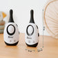 Baby monitor adapter, white body with dark top and oval display; two standing units