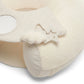 Cream fabric activity seat with star-shaped applique on a soft play panel