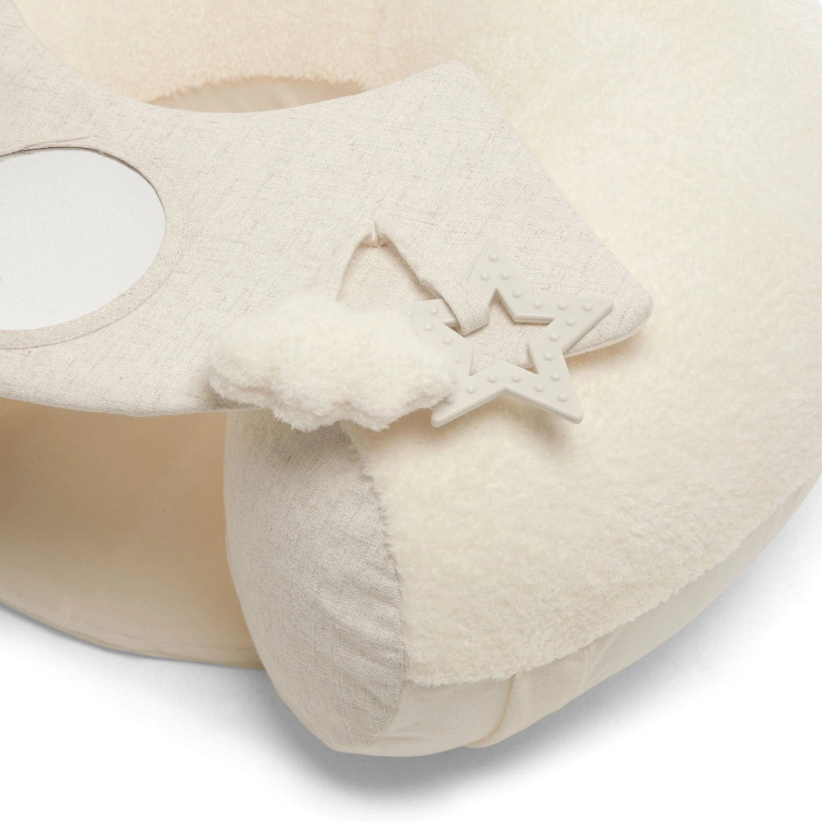 Cream fabric activity seat with star-shaped applique on a soft play panel
