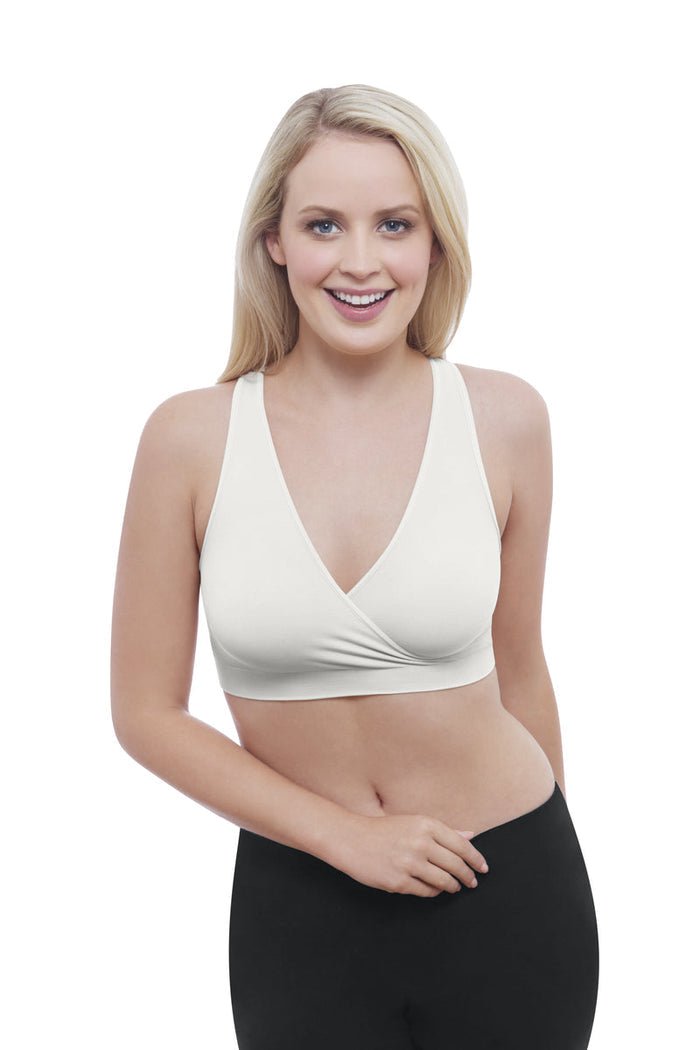 White sleep bra with V-neck and wrap-style crossover front, worn by model