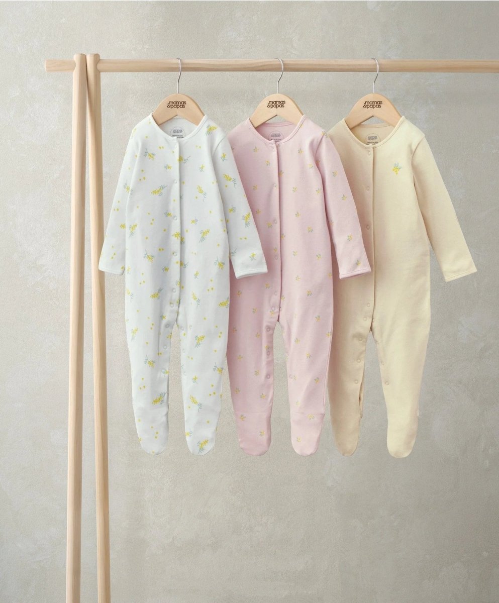 Pack of 3 footed newborn sleepsuits: white lemon print, pink, light yellow
