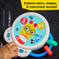 Musical toy panel close-up with numbers, drum, and colored buttons