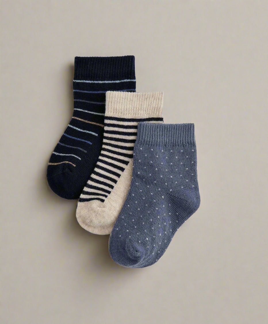 Smart socks pack of 3: navy, white striped, and gray-blue dot socks.