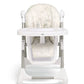 Highchair with cream fabric seat and back with subtle maze pattern, white frame