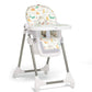 Baby high chair with white tray and colorful animal-print headrest and seat
