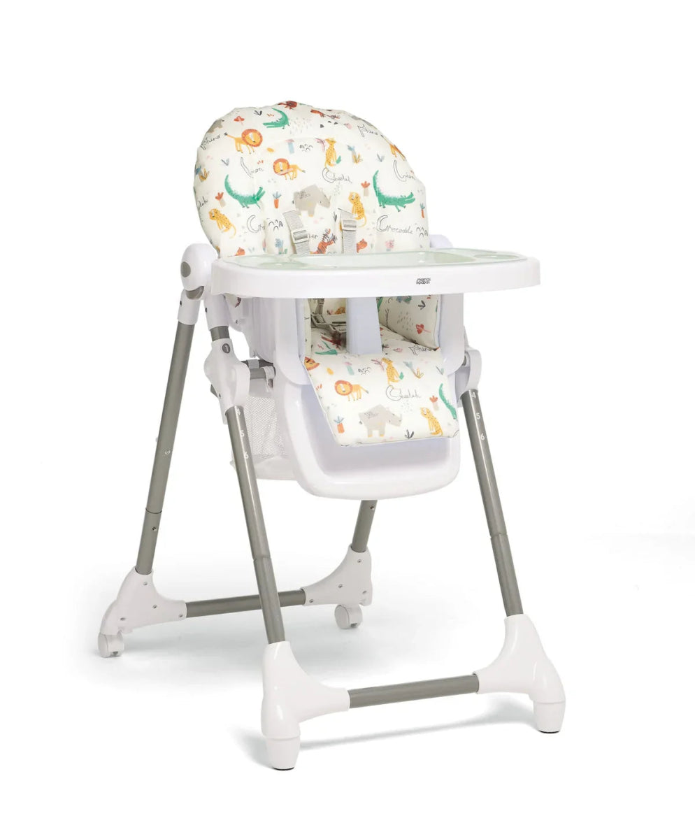 Baby high chair with white tray and colorful animal-print headrest and seat