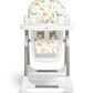 Patterned fabric highchair with white frame and illustrated animals on seat and back