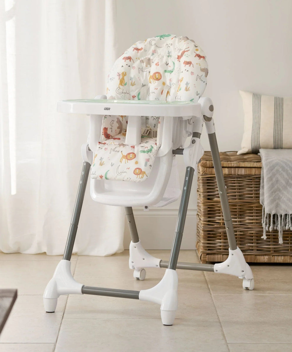 Baby high chair with white tray, light gray legs, and animal alphabet seat