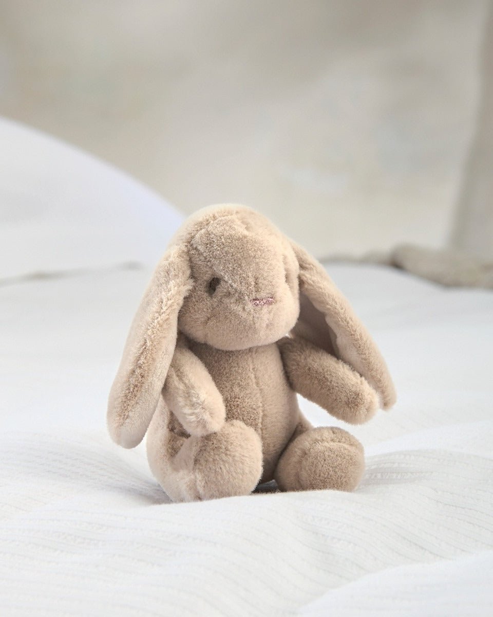 Bunny soft plush toy, beige plush with floppy ears and seated pose