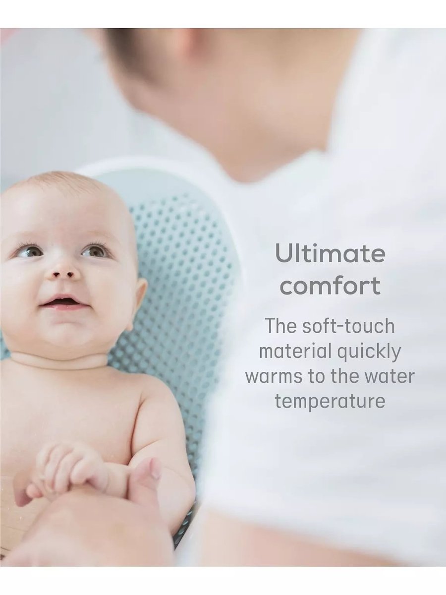 Baby bath support with soft-touch perforated surface for warm, comfortable support