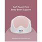 Pink baby bath support with soft-touch perforated insert and curved white base