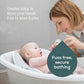 Soft Touch mini baby bath support with newborn reclined, caregiver holding the side