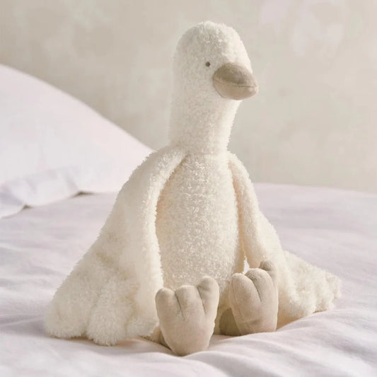 Cream plush duckling soft toy with floppy legs, sitting upright
