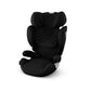 Black car seat with textured side panel and shoulder harness, angled view
