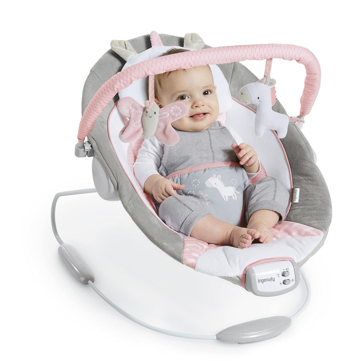 Infant in a gray and pink baby bouncer with toy bar and cushion
