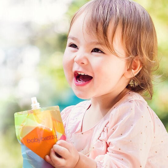 Spare food bag pouch in lime, orange, and blue with push cap, held by child