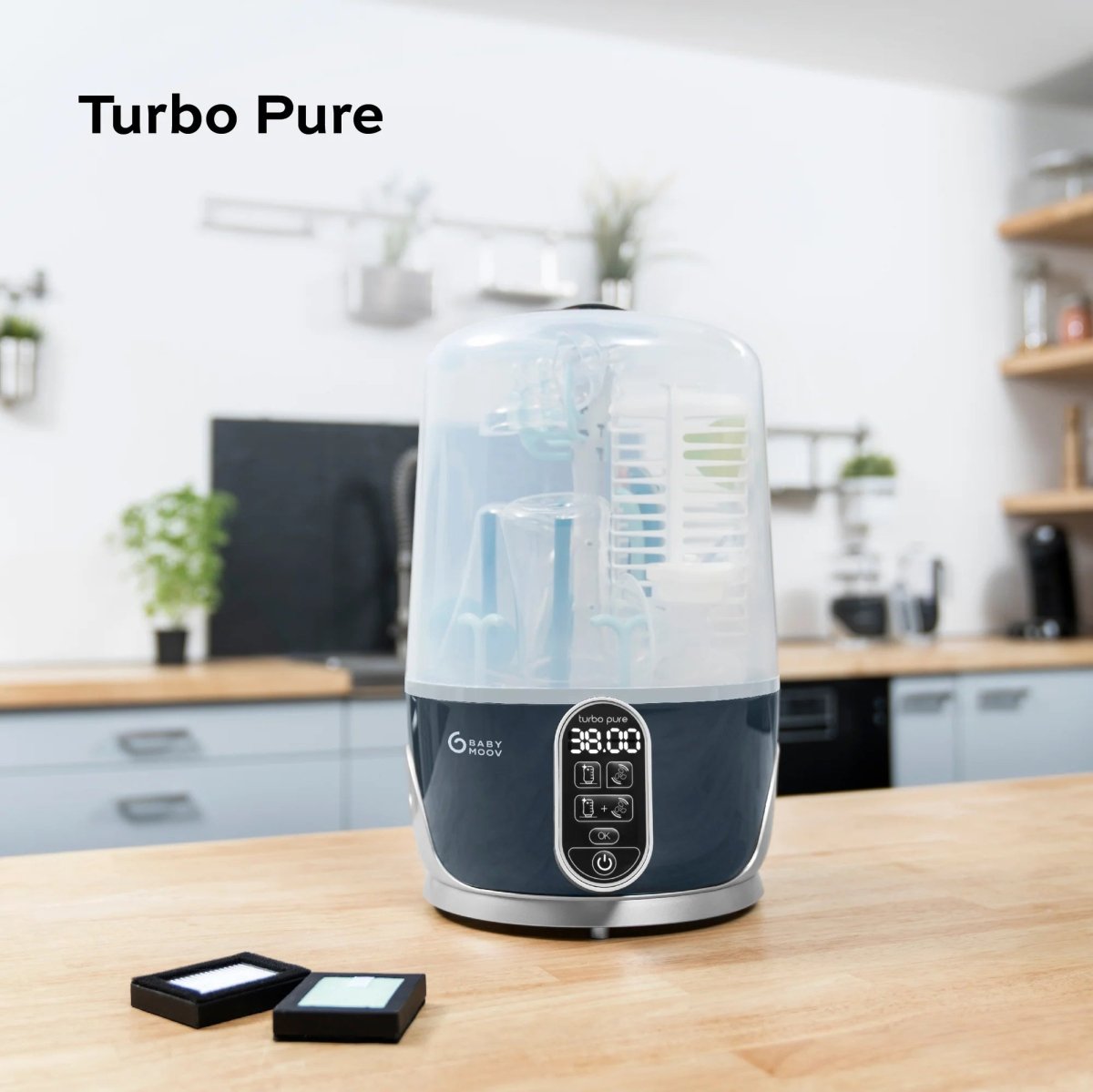 Steam sterilizer and dryer with clear dome lid, teal bottle rack, and glowing digital display panel