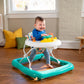 Activity walker in use: child seated in white patterned seat on teal frame