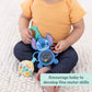 Stitch tummy tumble activity toy with teal handle, circular mirror, and small yellow fabric piece