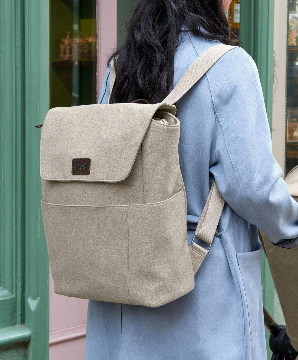 Strada backpack in pebble, front flap with logo patch and adjustable shoulder straps